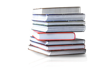 many books in a pile stand on the table on Isolated white background.