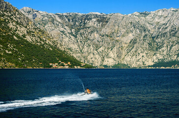 Fototapeta premium Water scooter on Adriatic sea at Bay of Kotor In Montenegro
