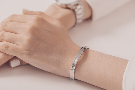 Woman wearing elegant silver bracelet