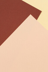 Color papers geometry composition background with yellow beige and brown tones