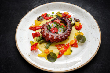 Grilled octopus tentacles with asparagus and sauce