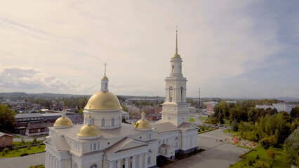 Top view of beautiful temple with Golden domes and bell tower in summer. Stock footage. Golden...