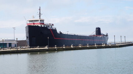 Black Ship at Dock on Sunny Day