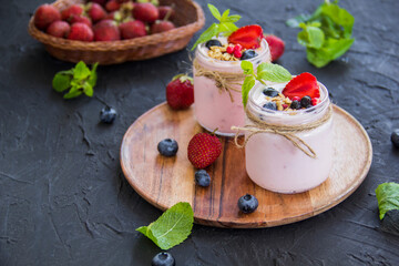 Healthy smoothie of fresh summer berries. Creative atmospheric decoration