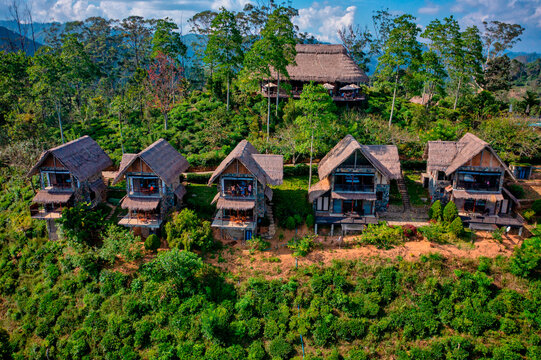 Aerial view of a few wooden houses in the forest, Badulla, Sri Lanka.