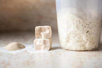 Instant and fresh yeast and sourdough in a jar. Natural leavening agents for baking.