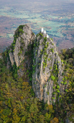 Aerial view of Wat Chaloem Phra Kiat Phrachomklao Rachanusorn, sky pagodas on top of mountain in Lampang Thailand