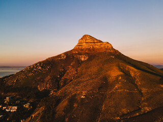Aerial view of Lion’s Head in golden hour sunset, Cape Town, South Africa.