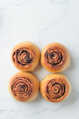 Round buns with poppy seeds