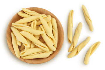 Typical Calabrian pasta called Maccheroncini or Maccheroni in wooden bowl isolated on white background with clipping path. Top view. Flat lay