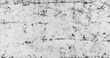 Old Dirty Rough Cracked White Painted Wall Surface. Grunge Texture Background Wallpaper.