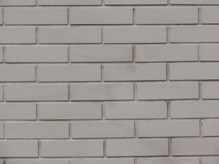 Close-up shot of a grey brick wall
