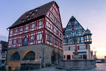 Obraz premium beautiful architecture of romantic Rothenburg ob der Tauber with timbered Fachwerkhaus syle houses in Bavaria Germany