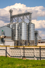 panorama view on agro silos granary elevator on agro-processing manufacturing plant for processing drying cleaning and storage of agricultural products, flour, cereals and grain. © hiv360