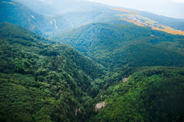 sunny day above green forest and  hills of Moravia