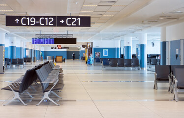 A Empty corridor at the international airport. - obrazy, fototapety, plakaty