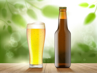 Glass of beer and a bottle on the background of nature.