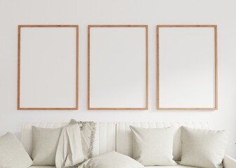 Three empty photo frame for mockup in living room. 3D rendering..