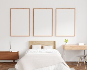 Three empty photo frame for mockup in bedroom. 3D rendering.