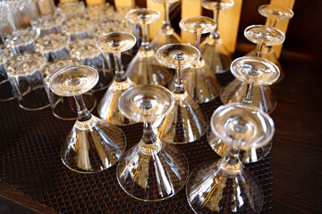 Empty martini glasses in a row in a bar