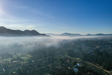 Aerial view of Pai rice fields during sunrise with fog in Mae Hong Son, Thailand