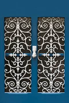 Blue door with ornamental class