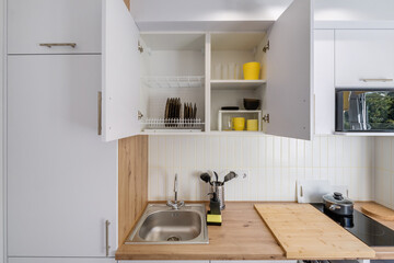 Interior of the modern kitchen in studio apartments in minimalistic style