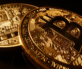 Macro view of golden bitcoin on microchip.