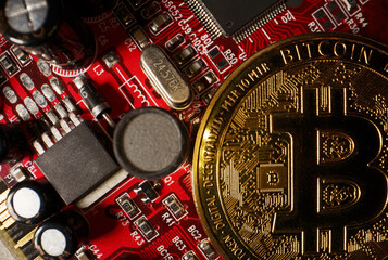Physical version of golden bitcoin on microchip.