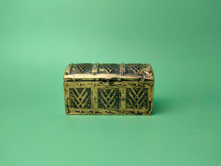 Treasure box on a soft green background.