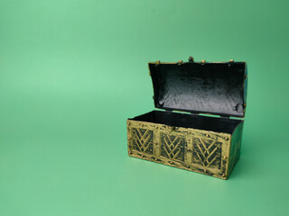 Treasure box on a soft green background.