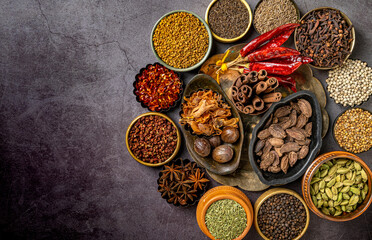 Top view of various Indian spices and seasonings on a table