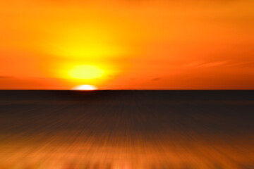 Blurry ocean landscape background and sunset view in digital motion effect.