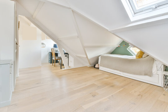 Bed on mansard with table