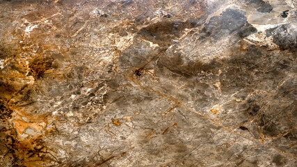 The texture of natural marble in brown tones with contrasting veins. Patterns for design works.