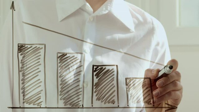 Business woman's hand draws statistics arrow, sales fall charts. Concept of crisis, risk.