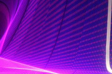 The purple electrons in the light source gain energy and perform accelerated motion