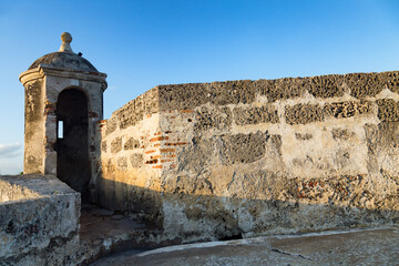 Light strikes an enclosed turret on the colonial wall in Cartagena, Colombia © Dandrewp/Wirestock Creators