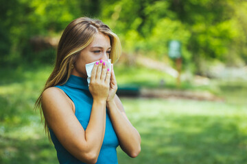 Woman Blowing Her Nose With Handkerchief In Public Parkf. Seasonal Virus Infection. Chronic Disease Control, Allergy Induced Asthma Remedy And Chronic Pulmonary Disease Concept.