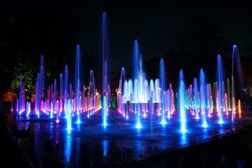 Beautiful view of the colorful fountains at night in the Litewski Square in Lublin