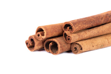 Dry cinnamon sticks on a white background. Cinnamon powder.