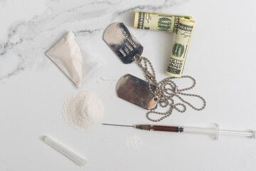 Drugs, money and syringes, isolated on White background