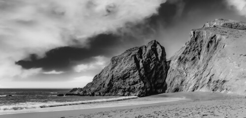 Scenic view of cliffs in Tennessee Beach CA the USA on a grayscale