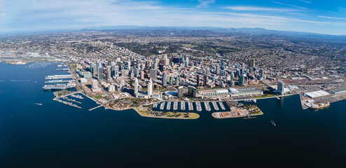 Aerial shot of the cityscape of downtown San Diego, California, surrounded by the ocean