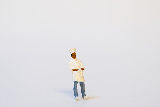 Miniature Chef In Work Clothes - Back View, White Background, Copy Space