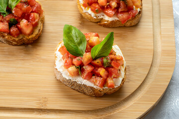 bruschetta with tomatoes, ricotta cheese and basil