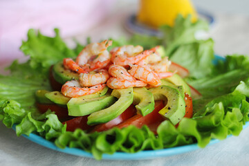 Salad with shrimp, avocado and tomatoes. Close-up.