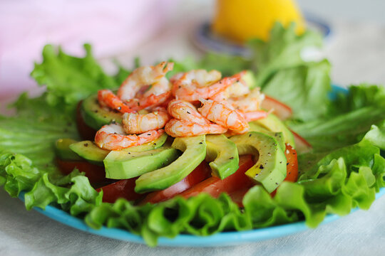 Salad with shrimp, avocado and tomatoes. Close-up.