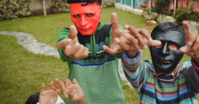 Close-up Shot Of South Asian Children Playing With Colorful Maske's