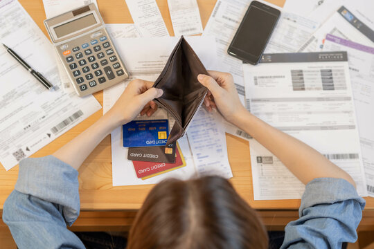 Stressed, Problem business person woman holding and open empty wallet, purse no have money for bill payment, credit card loan or expense. Bankruptcy, bankrupt or debt financial, mortgage concept.
